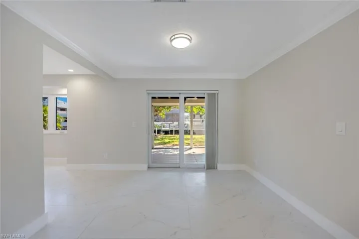 Dining area is located just off the kitchen. canal views while relaxing in your living room.