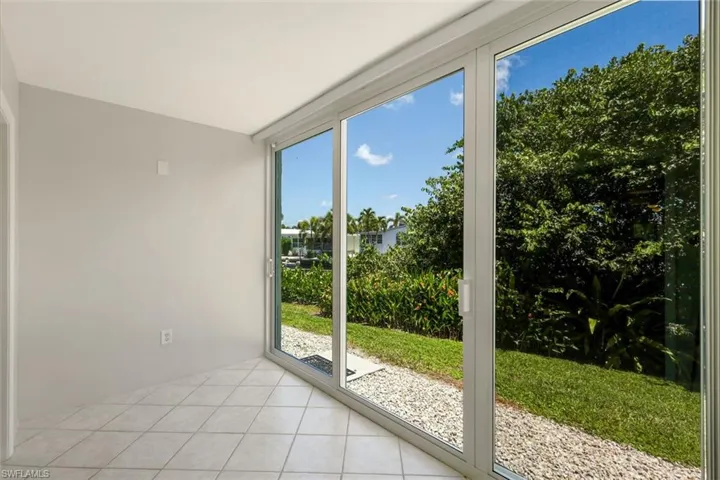 The lanai has been opened for add'l living area - impact sliders