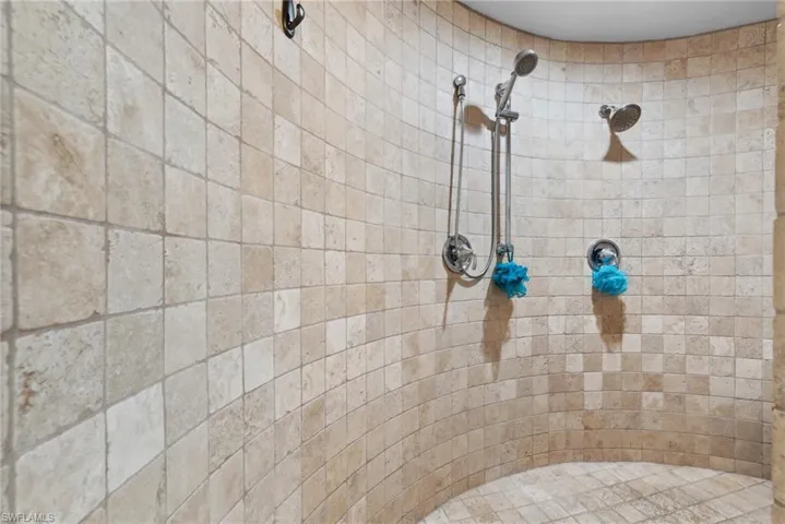Bathroom featuring a tile shower