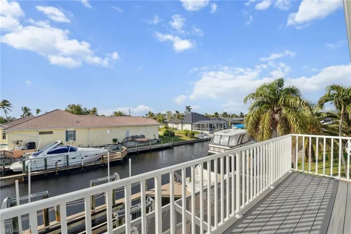 Dock area featuring a water view and a balcony