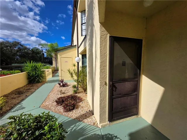 Entrance to property featuring stucco siding
