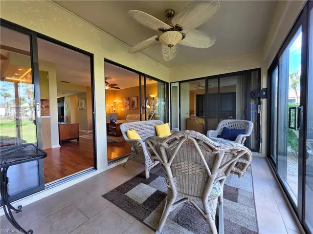Sunroom featuring a patio area and ceiling fan