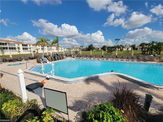 Community pool featuring a patio area