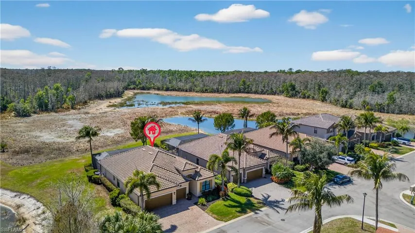 Bird's eye view of a nearby body of water and a heavily wooded area
