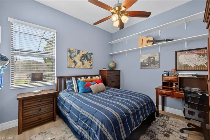 Bedroom featuring light wood finished floors and ceiling fan