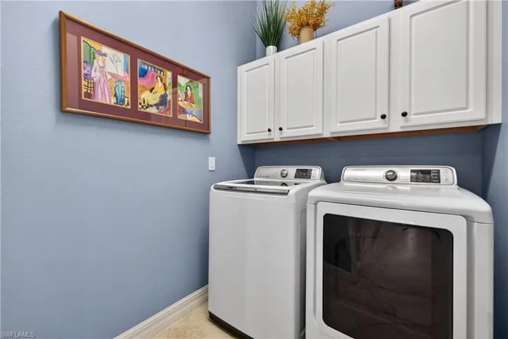 Laundry room featuring cabinet space and washer and dryer