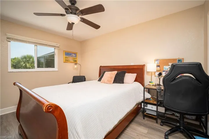 Bedroom featuring ceiling fan and light hardwood / wood-style flooring