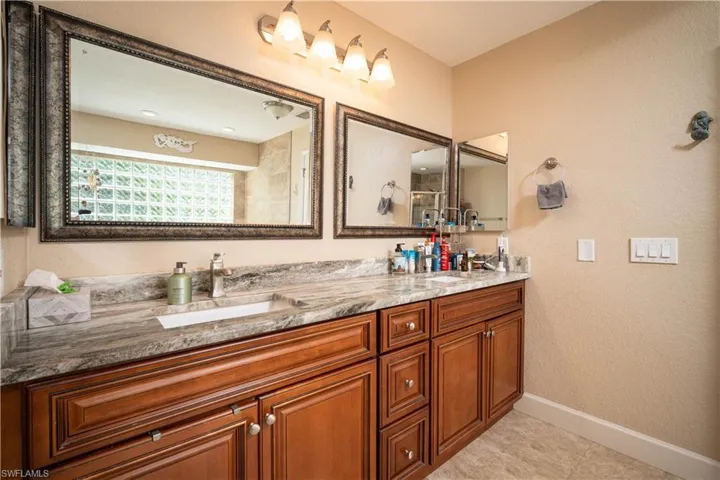 Bathroom featuring tile patterned flooring and vanity