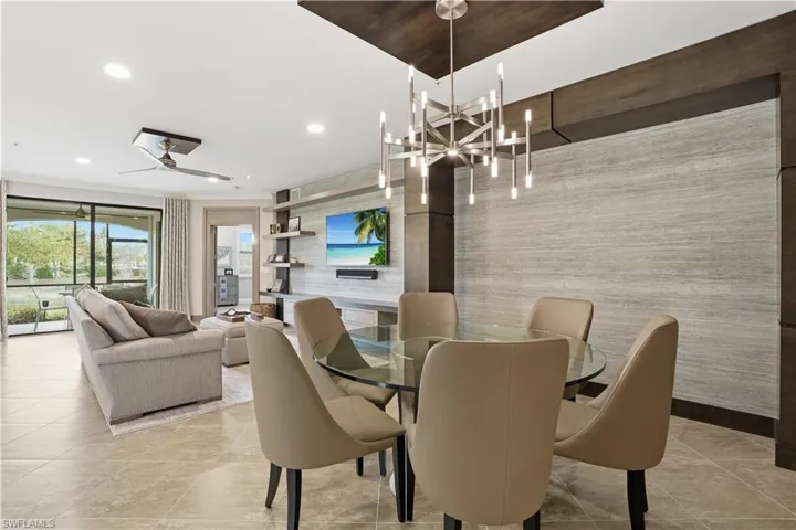 Dining area with a ceiling fan and recessed lighting
