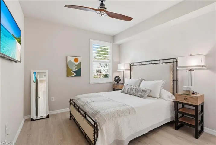 Bedroom featuring light wood-type flooring and ceiling fan