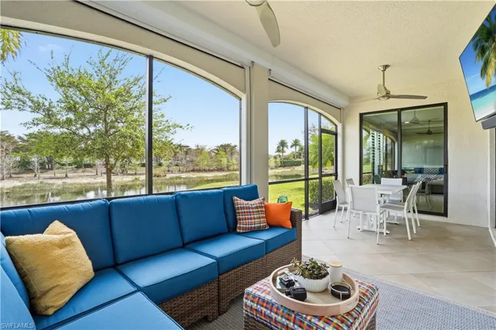 Sunroom / solarium with outdoor lounge area and a ceiling fan