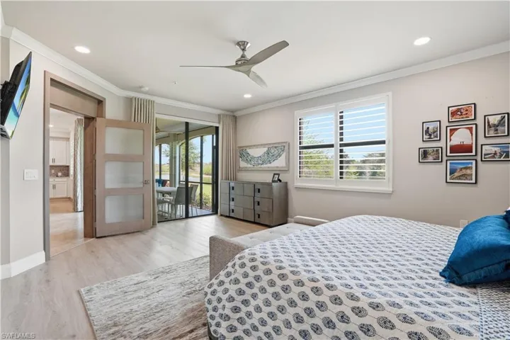Bedroom with light wood-style flooring, access to exterior, ornamental molding, ceiling fan, and recessed lighting
