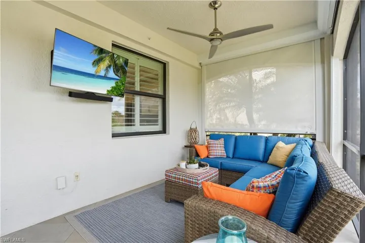 Sunroom featuring an outdoor living space, ceiling fan, and a patio area