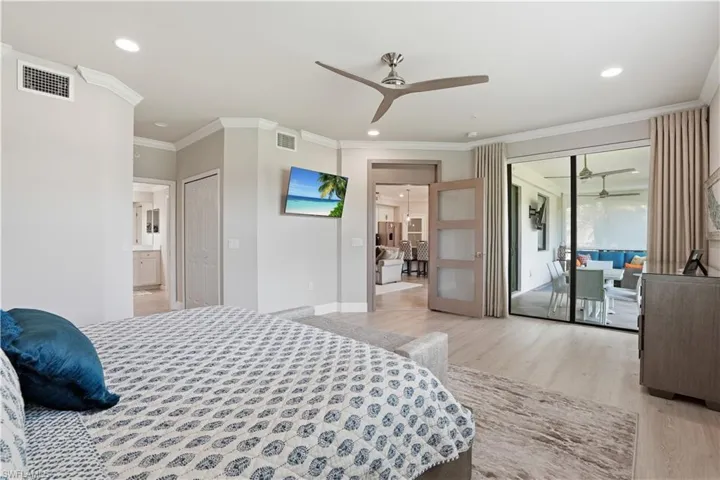 Bedroom featuring crown molding, access to outside, light wood finished floors, recessed lighting, and ceiling fan