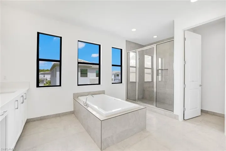 Bathroom with plus walk in shower and vanity