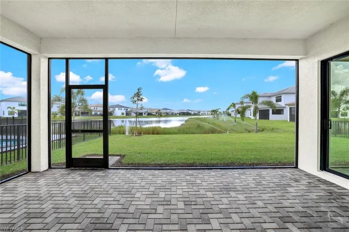 Unfurnished sunroom with a water view
