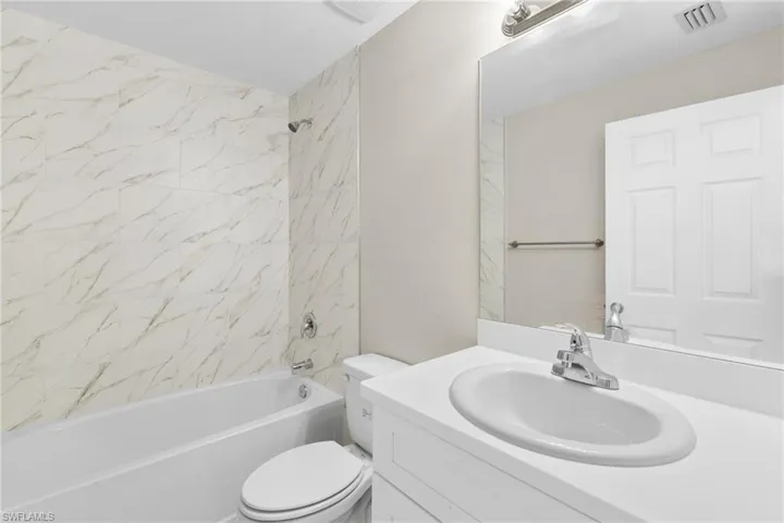Full bathroom with vanity and  shower combination