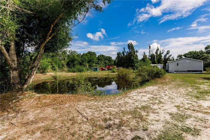 View of yard with a water view