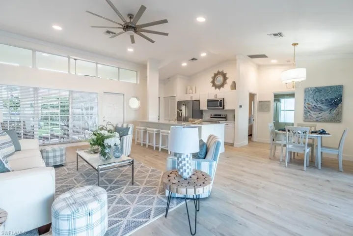 Open living room offers the casual Florida Style living that is so popular with full time residents and snowbirds alike. Furnishings may be purchased so you can close the sale, bring your toothbrush, and walk right in!