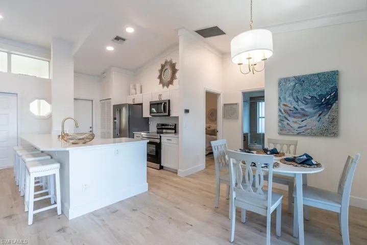 Overview of kitchen, entry and dining area.