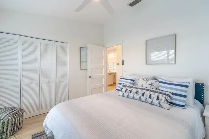 Confortable coastal bedroom with modern shaker style ladder door.
