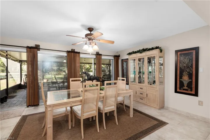 Dining room with ceiling fan and a wealth of natural light