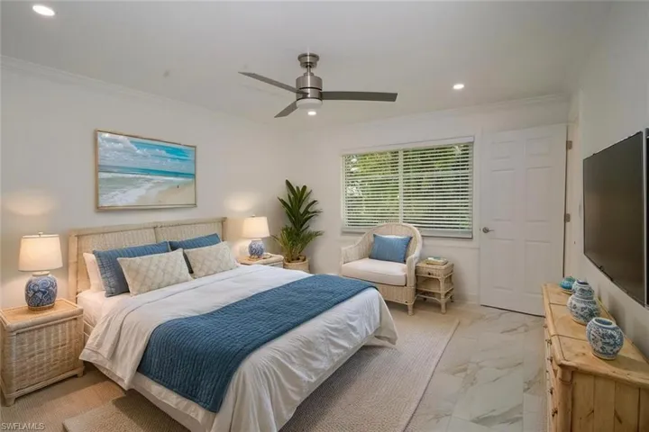 Master Bedroom with a ceiling fan, marble finish floor, recessed lighting, and crown molding