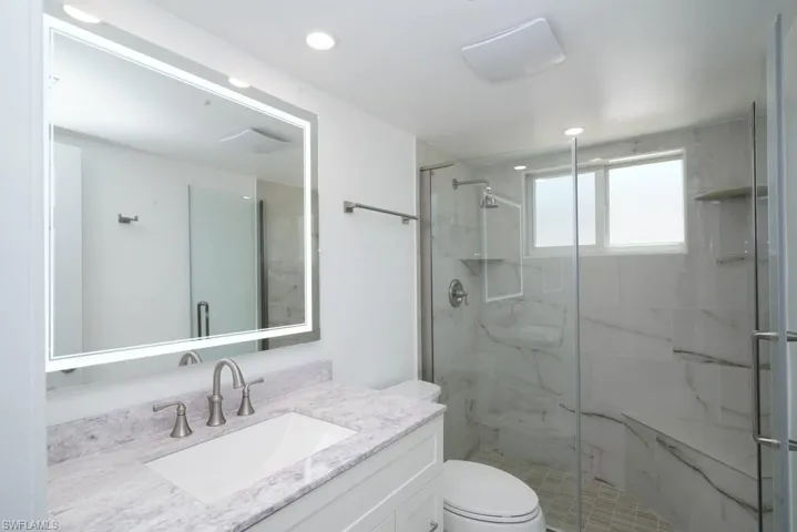 Master Full bath featuring new high-seat toilet, new shower and vanity