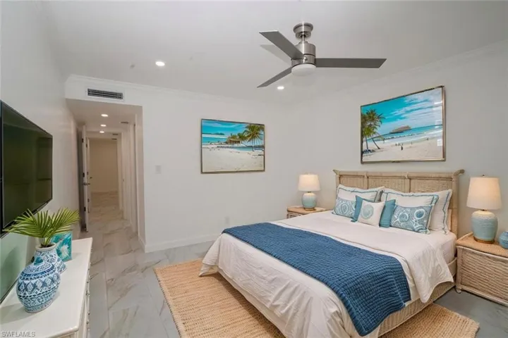 Master Bedroom with marble finish floor, ornamental molding, visible vents, and recessed lighting