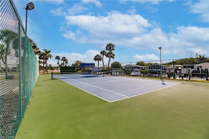 View of sport court with community basketball court and fence
