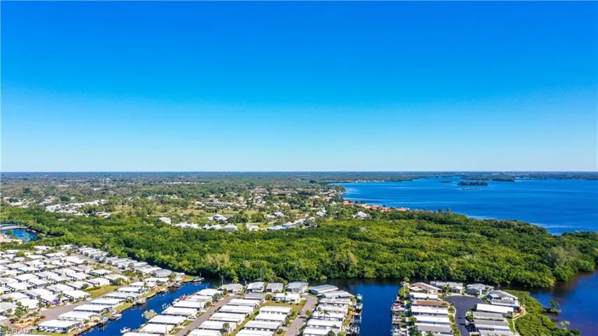 Aerial view featuring a water view and a residential view