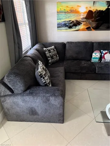 Living area featuring tile patterned floors
