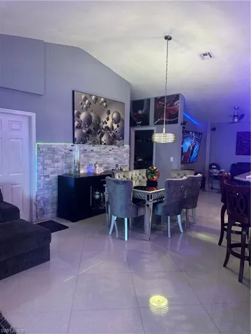 Dining space with vaulted ceiling