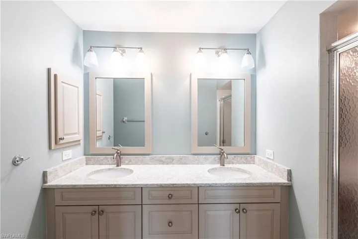 Bathroom with vanity and an enclosed shower