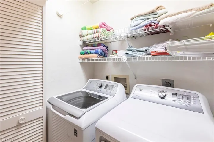 Washroom featuring washer and clothes dryer