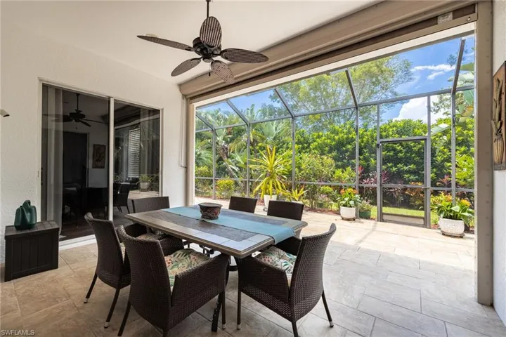 Screened in Lanai. See roofed over dining area with ceiling fan and hurricane shutter to protect the 3 entrances.
