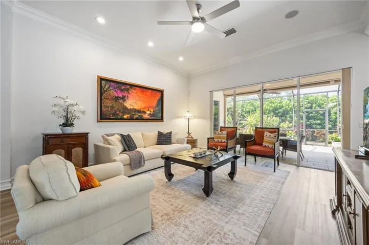 New ceiling fan, recessed lighting, full wall of sliding glass doors to lanai.