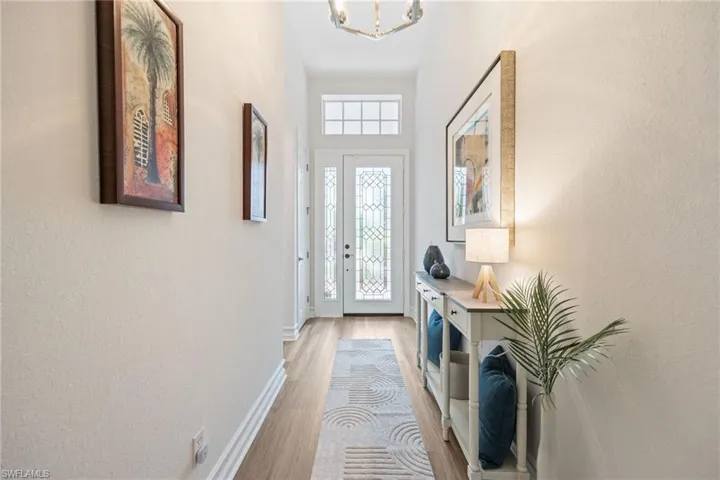 So much natural light! Foyer has a closet at entrance. Guest bedroom & bath on left.