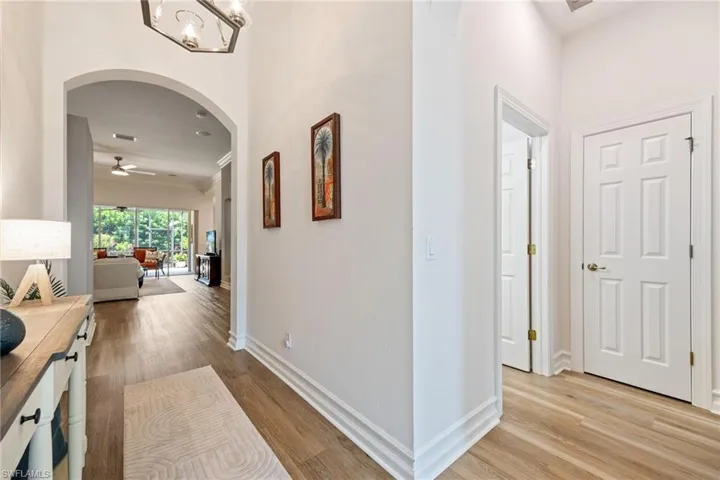 Exit the office and go left toward front of home. This hallway leads to guest bedroom and bath