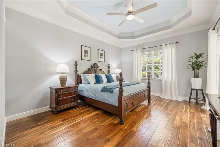 Warm wood flooring, expansive room accomodates oversized King Bed and more! There is great space to add exercise equipment, lounge furniture etc.