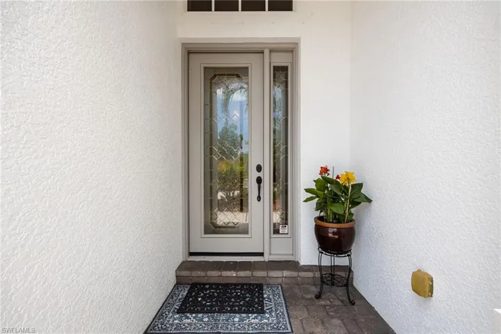 Covered entry. Hurricane Impact leaded glass door with sidelite
