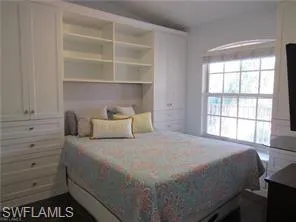 Bedroom with multiple windows