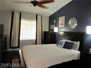 Bedroom featuring vaulted ceiling and ceiling fan