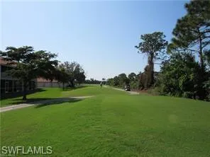 View of home's community with a yard