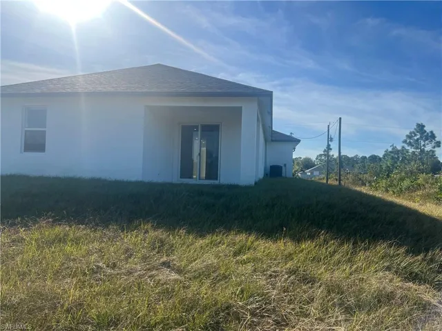 View of home's exterior featuring central AC