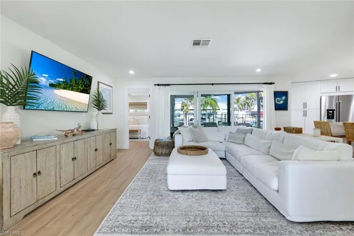 Living room featuring recessed lighting, light wood finished floors, and visible vents