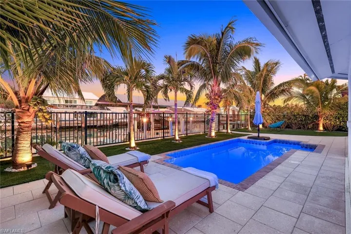 View of pool with a patio, fence, and a fenced in pool