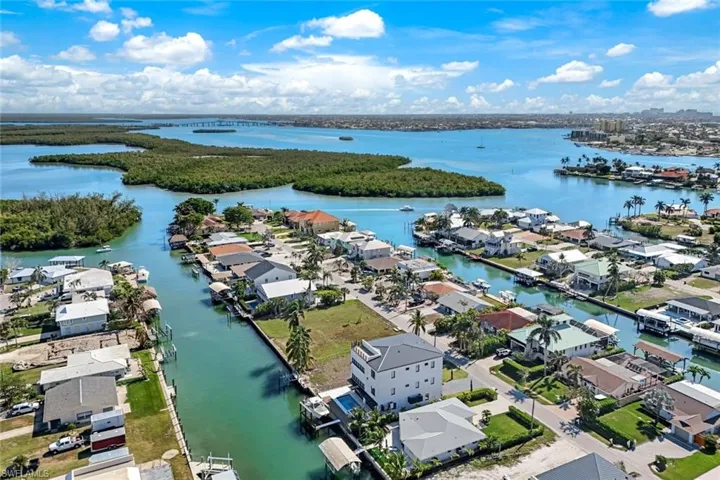 Aerial view featuring a residential view and a water view
