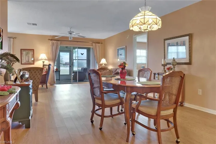 Entertaining is a breeze in the open living-dining room area with easy access to the glass-enclosed Florida room
