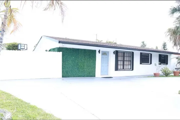 Ranch-style house with stucco siding